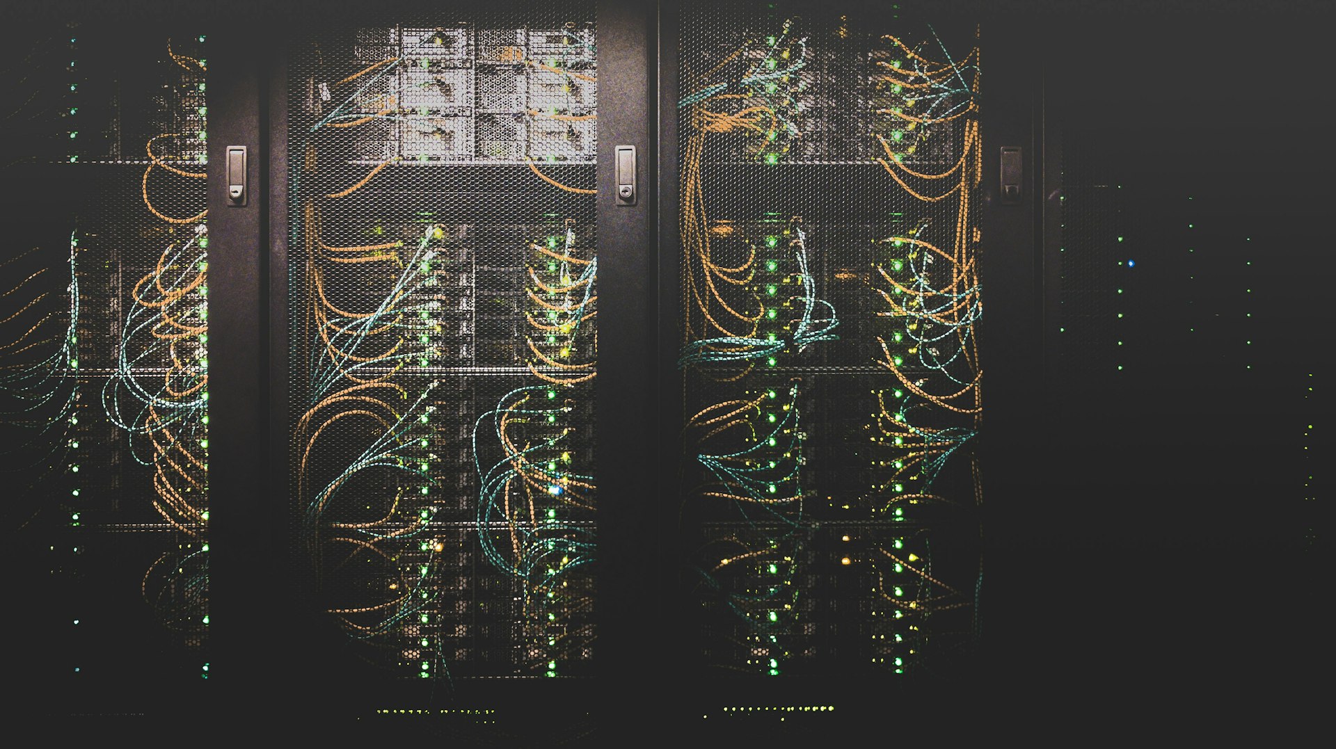 Server rack in a data center with cables and status lights